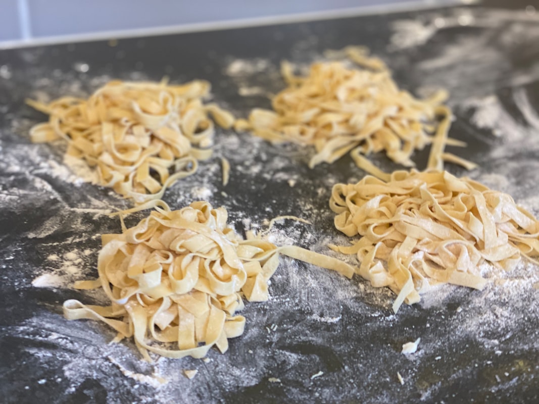 Students learning baking techniques